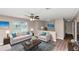 Staged living room showcasing a sofa, accent chair and an area rug at 5290 Forest Downs Ln, Atlanta, GA 30349