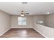 Bright and airy living room features modern floors, and neutral-colored walls at 5290 Forest Downs Ln, Atlanta, GA 30349