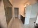 Modern bathroom with a glass-enclosed shower and a vanity with dark cabinets at 707 Dodd N Ln # 164, Buford, GA 30518