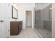 Bright bathroom featuring a walk-in shower and modern vanity at 707 Dodd N Ln # 164, Buford, GA 30518
