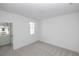 Bright and cozy bedroom space with neutral carpet, white walls, and natural light streaming through a window at 707 Dodd N Ln # 164, Buford, GA 30518