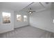 Spacious bedroom with large windows and recessed ceiling detail at 707 Dodd N Ln # 164, Buford, GA 30518