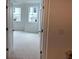 Bright bedroom with a neutral color palette and natural light pouring through the windows at 707 Dodd N Ln # 164, Buford, GA 30518