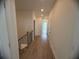 Bright hallway features wood floors and access to rooms, offering a clean and modern aesthetic at 707 Dodd N Ln # 164, Buford, GA 30518