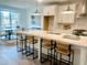 Bright, modern kitchen featuring white cabinets, stainless steel appliances, island with bar seating, and pendant lighting at 707 Dodd N Ln # 164, Buford, GA 30518
