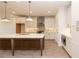 Eat-in kitchen with a large central island, pendant lighting, and stainless appliances at 707 Dodd N Ln # 164, Buford, GA 30518