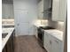 This kitchen has white cabinets, stainless steel appliances, and an island with a sink at 707 Dodd N Ln # 164, Buford, GA 30518