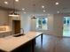 Bright kitchen featuring a center island with white countertop and stainless steel appliances at 707 Dodd N Ln # 164, Buford, GA 30518