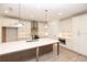 Bright eat-in kitchen featuring a large central island with pendant lighting and modern appliances at 707 Dodd N Ln # 164, Buford, GA 30518