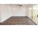 Spacious living room with hardwood floors, sliding glass doors to the patio, and ample natural light at 707 Dodd N Ln # 164, Buford, GA 30518