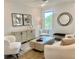 Comfortable living room with modern furnishings, neutral color palette, and decorative artwork, offering a relaxing atmosphere at 707 Dodd N Ln # 164, Buford, GA 30518