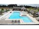 Stunning community pool featuring crystal blue waters, lounge seating, and a covered pavilion at 707 Dodd N Ln # 164, Buford, GA 30518