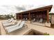 Relaxing poolside lounge area with comfortable seating and shade for a perfect outdoor experience at 707 Dodd N Ln # 164, Buford, GA 30518