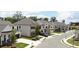 Charming street view showcases new homes with varied architecture, landscaping, and curb appeal at 707 Dodd N Ln # 164, Buford, GA 30518