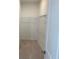 A carpeted walk-in closet with a white wire shelving system at 707 Dodd N Ln # 164, Buford, GA 30518