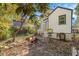 Backyard view with wooden fence, mature foliage, and the exterior of a home with light-colored siding at 763 Jones Nw Ave, Atlanta, GA 30314