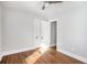 Cozy bedroom featuring hardwood floors, a ceiling fan, neutral paint, and a standard closet at 763 Jones Nw Ave, Atlanta, GA 30314