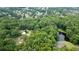 Aerial view showcasing a lush, green residential area with a nearby body of water and surrounding trees at 789 Concord Sw Rd, Smyrna, GA 30082
