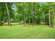 Expansive backyard features lush greenery and mature trees, creating a serene, private oasis at 789 Concord Sw Rd, Smyrna, GA 30082