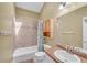 Bathroom featuring a shower-tub combination and a granite vanity at 789 Concord Sw Rd, Smyrna, GA 30082
