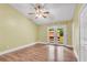 Bright bedroom featuring wood floors, ceiling fan, and French doors leading to outdoor area at 789 Concord Sw Rd, Smyrna, GA 30082