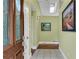 Inviting foyer with tiled floor, decorative glass front door, and natural light from skylight at 789 Concord Sw Rd, Smyrna, GA 30082