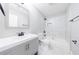 Modern bathroom featuring marble-tiled walls, sleek fixtures, and updated vanity at 141 Nathan Rd, Atlanta, GA 30331