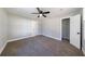 Spacious bedroom featuring neutral gray walls, plush carpeting, and a modern ceiling fan at 141 Nathan Rd, Atlanta, GA 30331