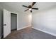 Bright bedroom featuring neutral gray walls, plush carpeting, closet and a modern ceiling fan at 141 Nathan Rd, Atlanta, GA 30331