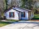 Picture perfect exterior showing the white siding and brown trim at 141 Nathan Rd, Atlanta, GA 30331