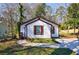 Charming home with curb appeal featuring shutters, a walkway, and well-kept lawn at 141 Nathan Rd, Atlanta, GA 30331