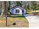 Charming home with a well-maintained lawn, long driveway, and classic mailbox at 141 Nathan Rd, Atlanta, GA 30331