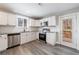 Bright kitchen featuring stainless steel appliances and white cabinets at 141 Nathan Rd, Atlanta, GA 30331