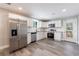Modern kitchen featuring stainless steel appliances and sleek white cabinetry at 141 Nathan Rd, Atlanta, GA 30331