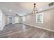 Open-concept living room with a decorative chandelier at 141 Nathan Rd, Atlanta, GA 30331