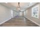 Expansive living room boasts modern flooring, fresh paint, and abundant natural light at 141 Nathan Rd, Atlanta, GA 30331