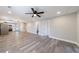 Spacious living area showcasing wood-look flooring, neutral walls, and an open layout to the kitchen at 141 Nathan Rd, Atlanta, GA 30331
