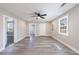 Open floor plan living space featuring vinyl plank flooring, neutral walls, and a ceiling fan at 141 Nathan Rd, Atlanta, GA 30331