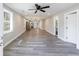 Open-concept living room with recessed lights and durable, wood-look floors at 141 Nathan Rd, Atlanta, GA 30331