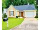 Charming single-Gathering home with well-maintained lawn and attached garage at 3793 Mays Sw Ct, Atlanta, GA 30331