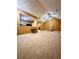 Bright living room featuring vaulted ceilings, fan, and ample natural light at 3793 Mays Sw Ct, Atlanta, GA 30331