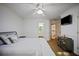 Bedroom featuring a queen bed, carpet floors, and a door to the bathroom at 385 Guildhall Grv, Johns Creek, GA 30022