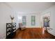 Cozy living room with hardwood floors and ample natural light at 385 Guildhall Grv, Johns Creek, GA 30022