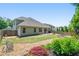 Backyard features a stone walk path, small bridge and view of the house at 813 Cotton Creek Dr, Canton, GA 30115