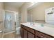 Bathroom features a double vanity, tile floors and walk-in shower at 813 Cotton Creek Dr, Canton, GA 30115