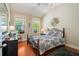 Bedroom with hard wood floors and great views of the outdoors at 813 Cotton Creek Dr, Canton, GA 30115