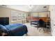 Bedroom with sloped ceiling, carpet, storage racks and large windows at 813 Cotton Creek Dr, Canton, GA 30115