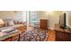 Neutral bedroom features a daybed, area rug, dresser and flatscreen TV at 813 Cotton Creek Dr, Canton, GA 30115