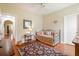 Bedroom with door leading to the hallway, ceiling fan, area rug, daybed at 813 Cotton Creek Dr, Canton, GA 30115