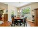 Cozy breakfast nook with a large window and natural light overlooking the backyard at 813 Cotton Creek Dr, Canton, GA 30115